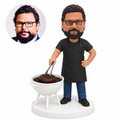 custom bobblehead figure man barbecuing at a kettle grill