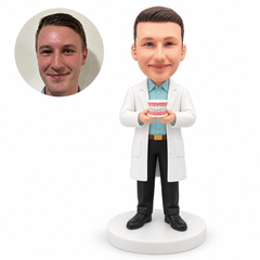 custom bobblehead figure male dentist presenting a denture model