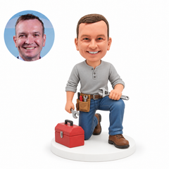 custom bobblehead figure kneeling repairman with wrenches and a toolbox