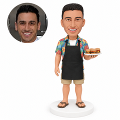 custom bobblehead figure man in an apron holding a burger platter