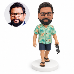 custom bobblehead figure walking man in a tropical shirt holding sunglasses