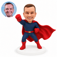 custom bobblehead figure man in a cape punching forward with his other fist at his chest