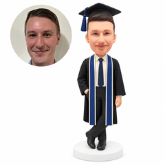 custom bobblehead figure male graduate with a long stole and one hand in his pocket - custom polymer clay bobblehead figure