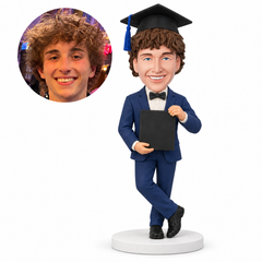 custom bobblehead figure male graduate in a bow-tie suit holding a folder with crossed ankles - custom polymer clay bobblehead figure