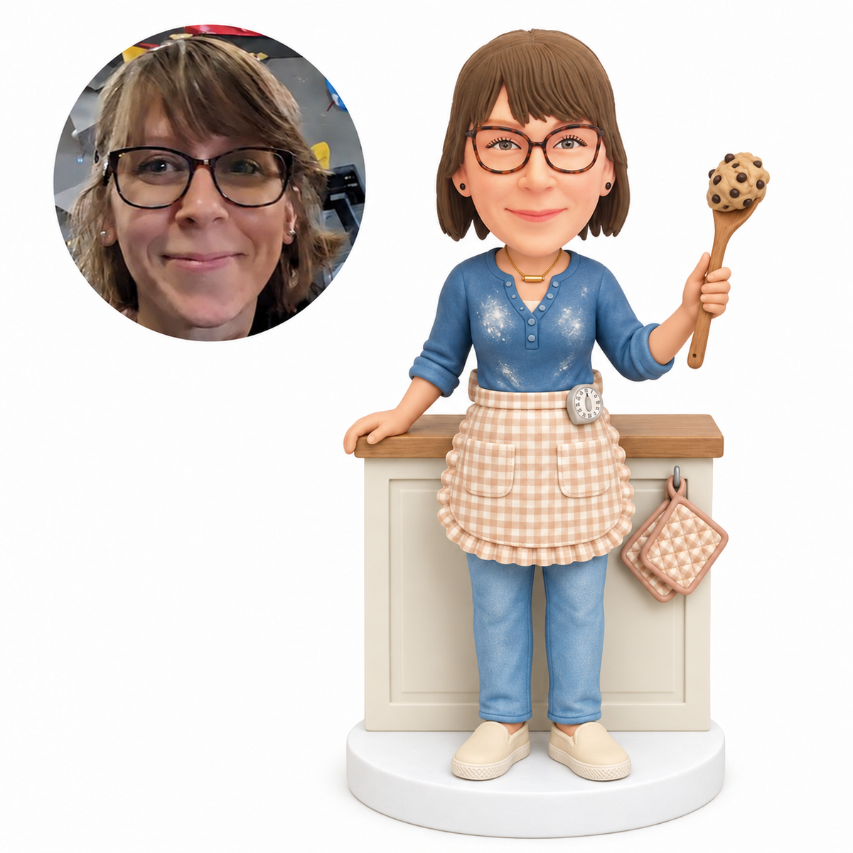 custom bobblehead figure female baker holding a wooden spoon beside a kitchen counter - custom polymer clay bobblehead figure