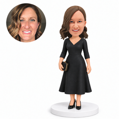 custom bobblehead figure woman in a v-neck dress holding a clutch bag