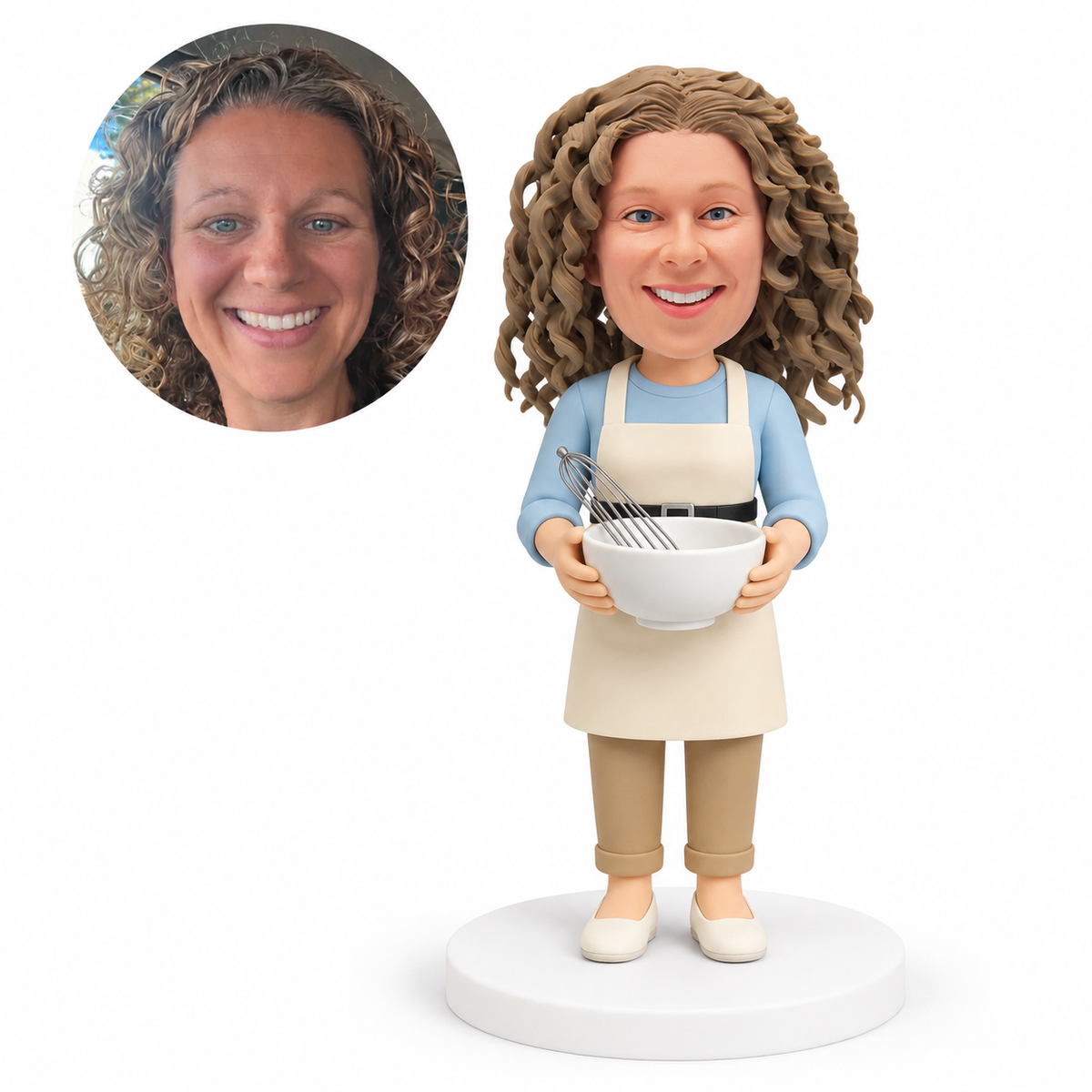 custom bobblehead figure woman in an apron holding a mixing bowl with a whisk