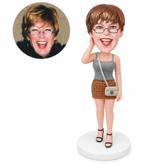 custom bobblehead figure woman in a tank top and mini skirt with a crossbody purse
