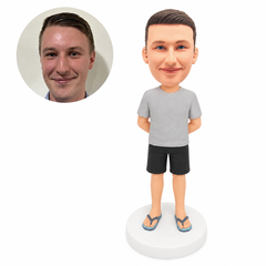 custom bobblehead figure man in a T-shirt and shorts with hands behind his back and flip-flops