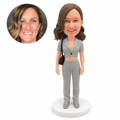 custom bobblehead figure woman in a cropped short-sleeve jacket and trousers with a shoulder bag