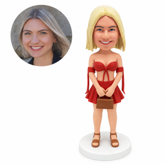 custom bobblehead figure woman in a strapless bow crop top and a beach mini skirt holding a handbag