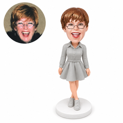 custom bobblehead figure woman in a belted shirt mini dress with crossed ankles