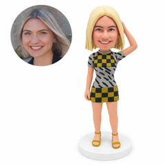 custom bobblehead figure woman in a short-sleeve mini dress with one hand on top of her head
