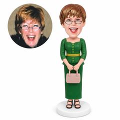 custom bobblehead figure woman in a sweetheart-neck skirt suit holding a handbag