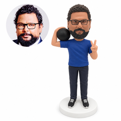 custom bobblehead figure man holding a ball over one shoulder and making a peace sign