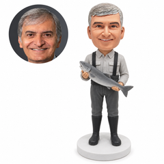 custom bobblehead figure fisherman in gray workwear and suspenders holding a large fish