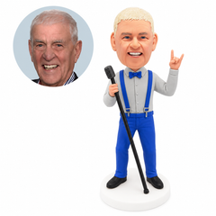custom bobblehead figure singer in suspenders making a rock hand sign at a microphone stand