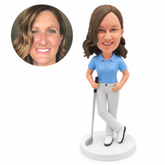 custom bobblehead figure female golfer in a polo and trousers holding a golf club with crossed ankles