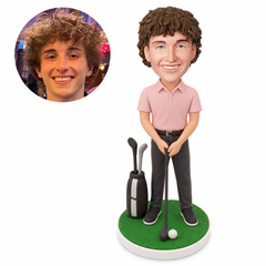 custom bobblehead figure male golfer holding a club in front with a golf bag and ball