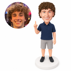 custom bobblehead figure man in a polo and shorts pointing one index finger upward
