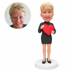 custom bobblehead figure woman in a long-sleeve dress holding a heart