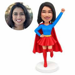 custom bobblehead figure woman in a hero outfit with one fist raised and one leg lifted
