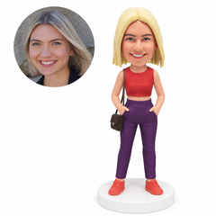 custom bobblehead figure woman in a cropped tank top and trousers with both hands in her pockets