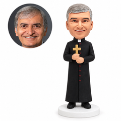 custom bobblehead figure priest in a long robe holding a cross with both hands