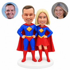 custom bobblehead figures hero couple in capes standing with hands on their hips
