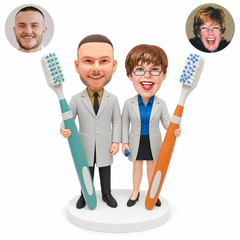 custom bobblehead figures dentist couple each holding a giant toothbrush