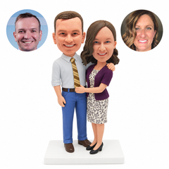 custom bobblehead figures couple with a man in a tie resting an arm around a woman
