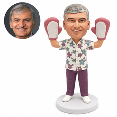 custom bobblehead figure man raising both hands in oversized oven mitts