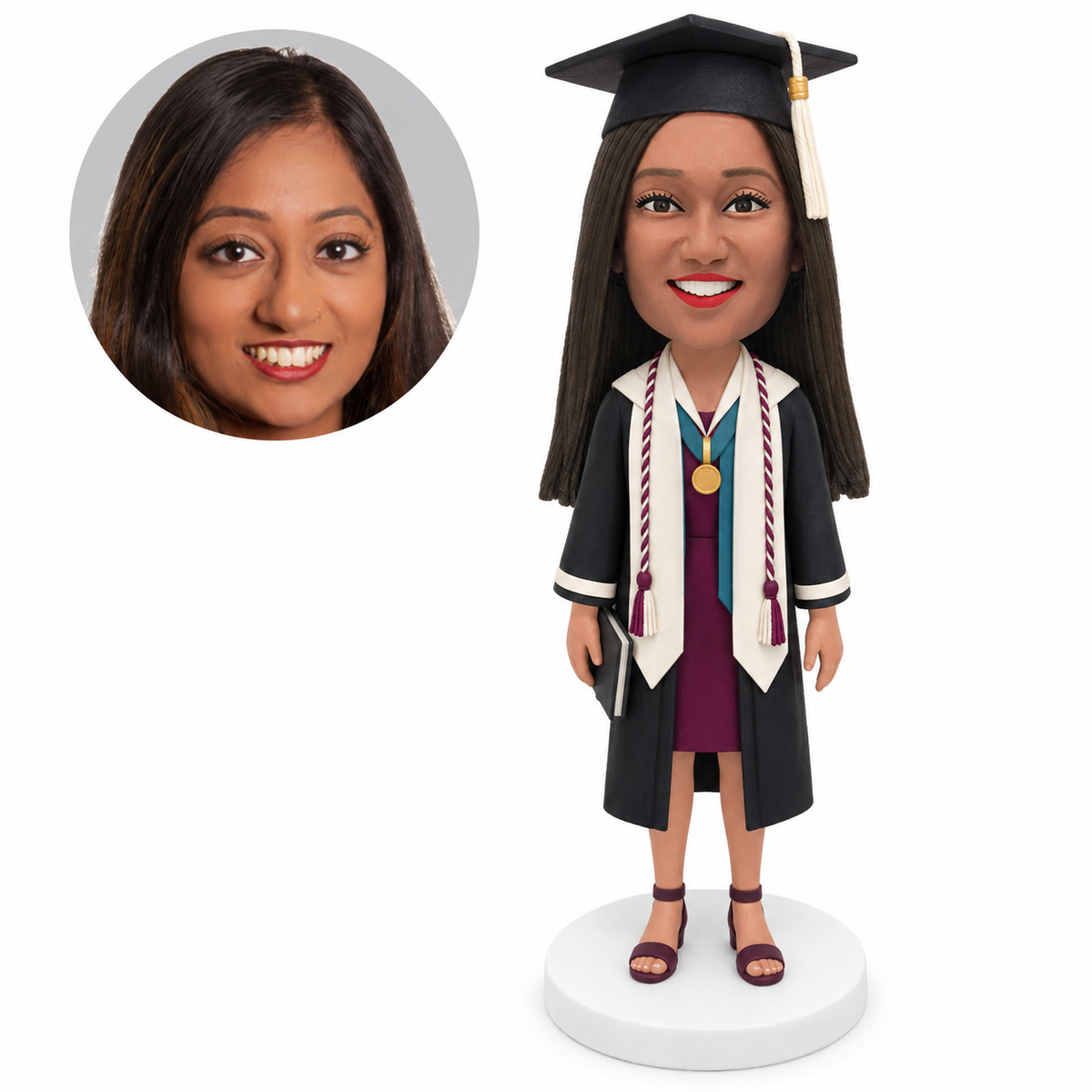 custom bobblehead figure female graduate with honor cords and a medal holding a book at her side