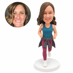 custom bobblehead figure woman in sports leggings with a jacket tied at her waist and both thumbs raised