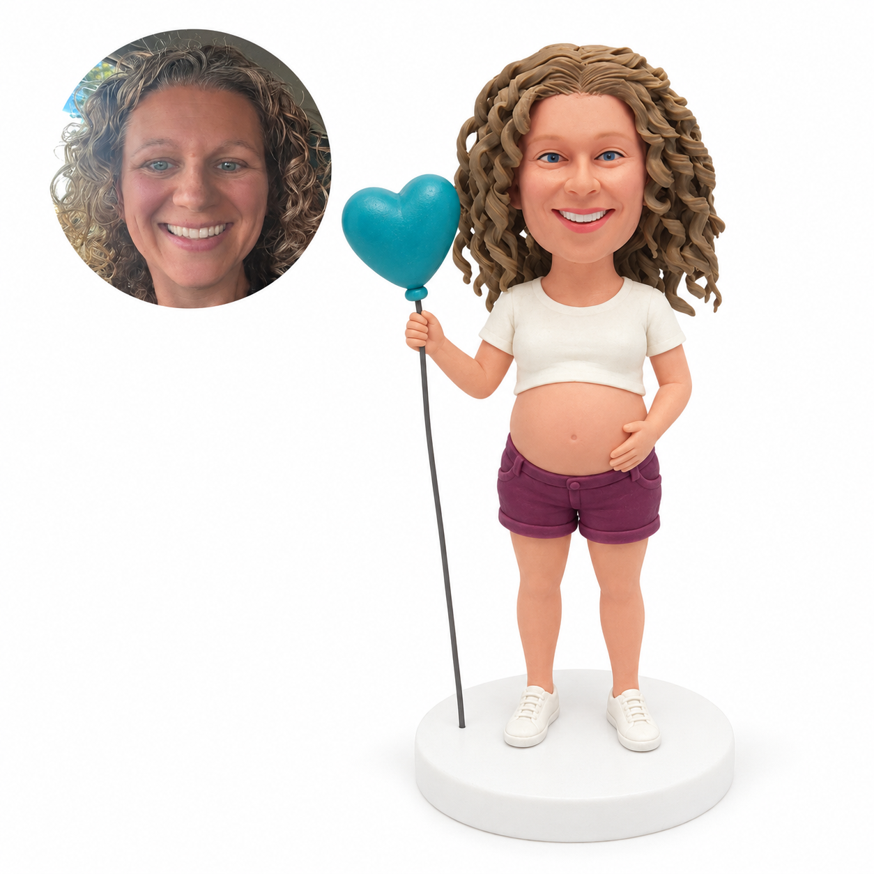 custom bobblehead figure pregnant woman in a cropped T-shirt and shorts holding a heart-shaped balloon