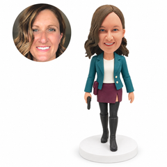 custom bobblehead figure woman in a jacket and skirt with knee-high boots holding a pistol model