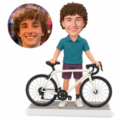 custom bobblehead figure man in a polo shirt and shorts standing behind a road bicycle