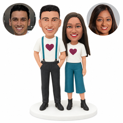 custom bobblehead figures casual couple in matching heart tops with woman linking his arm