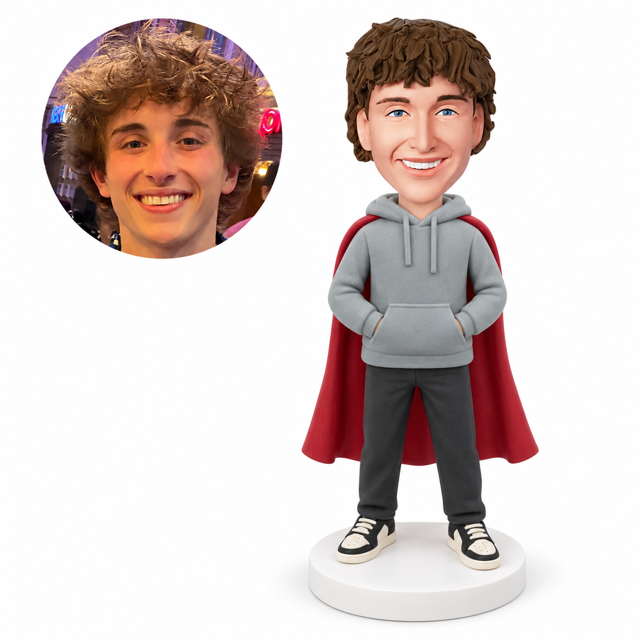 custom bobblehead figure man in a hoodie and cape with both hands in the front pocket