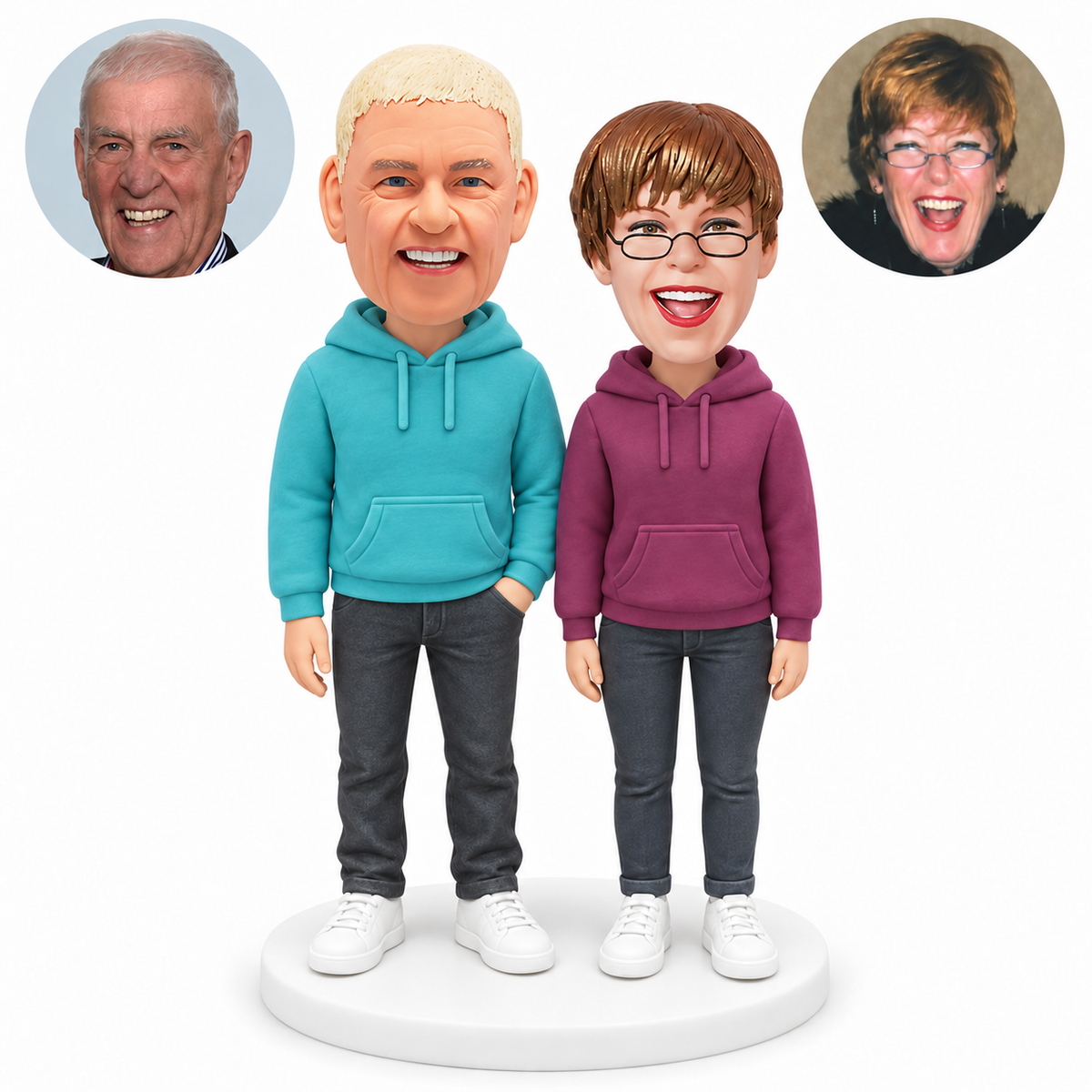 custom bobblehead figures older couple in hoodies with one man hand in trouser pocket; original Bobblefigurine polymer clay heads with matching circular human portraits.