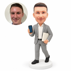 custom bobblehead figure businessman showing a phone and carrying a book