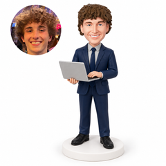 custom bobblehead figure male software engineer supporting and typing on an open laptop