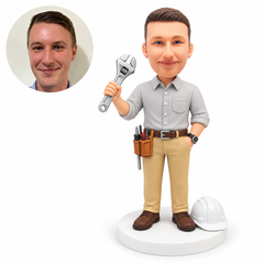 custom bobblehead figure male engineer raising an adjustable wrench beside a hardhat