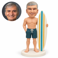 custom bobblehead figure shirtless male surfer holding an upright board with one hand in his pocket