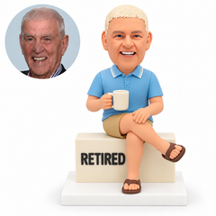 custom bobblehead figure retired man seated cross-legged on a block with a mug