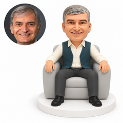 custom bobblehead figure businessman seated with feet apart and both hands resting on the armrests of an armchair