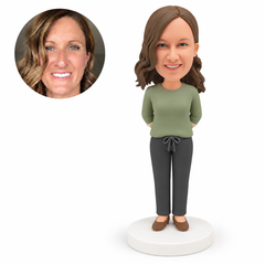 custom bobblehead figure woman in a long-sleeved top and full trousers standing with both hands behind her back