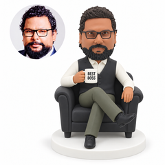 custom bobblehead figure man in a vest seated in an armchair with crossed legs holding a mug MGA-AC1205
