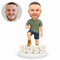 custom bobblehead figure man in shorts giving a thumbs up with one foot resting on BOSS letters MGA-AC1206