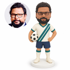 custom bobblehead figure male soccer player holding a ball at one hip with his other hand on his hip
